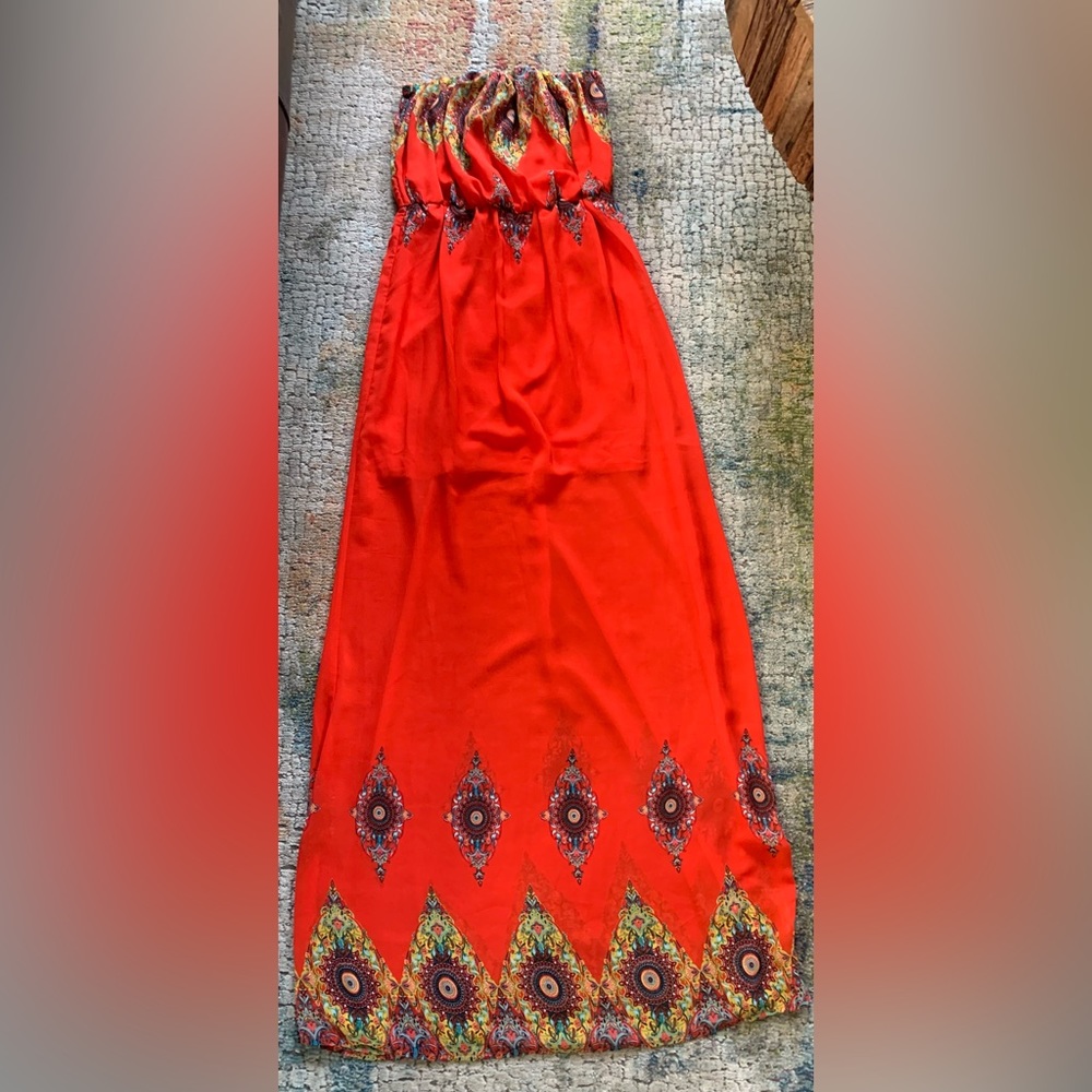 Red strapple dress. For All ocassions and very fashionable.Size small and fits M